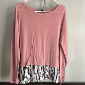 pink sweater with striped ruffle bottom